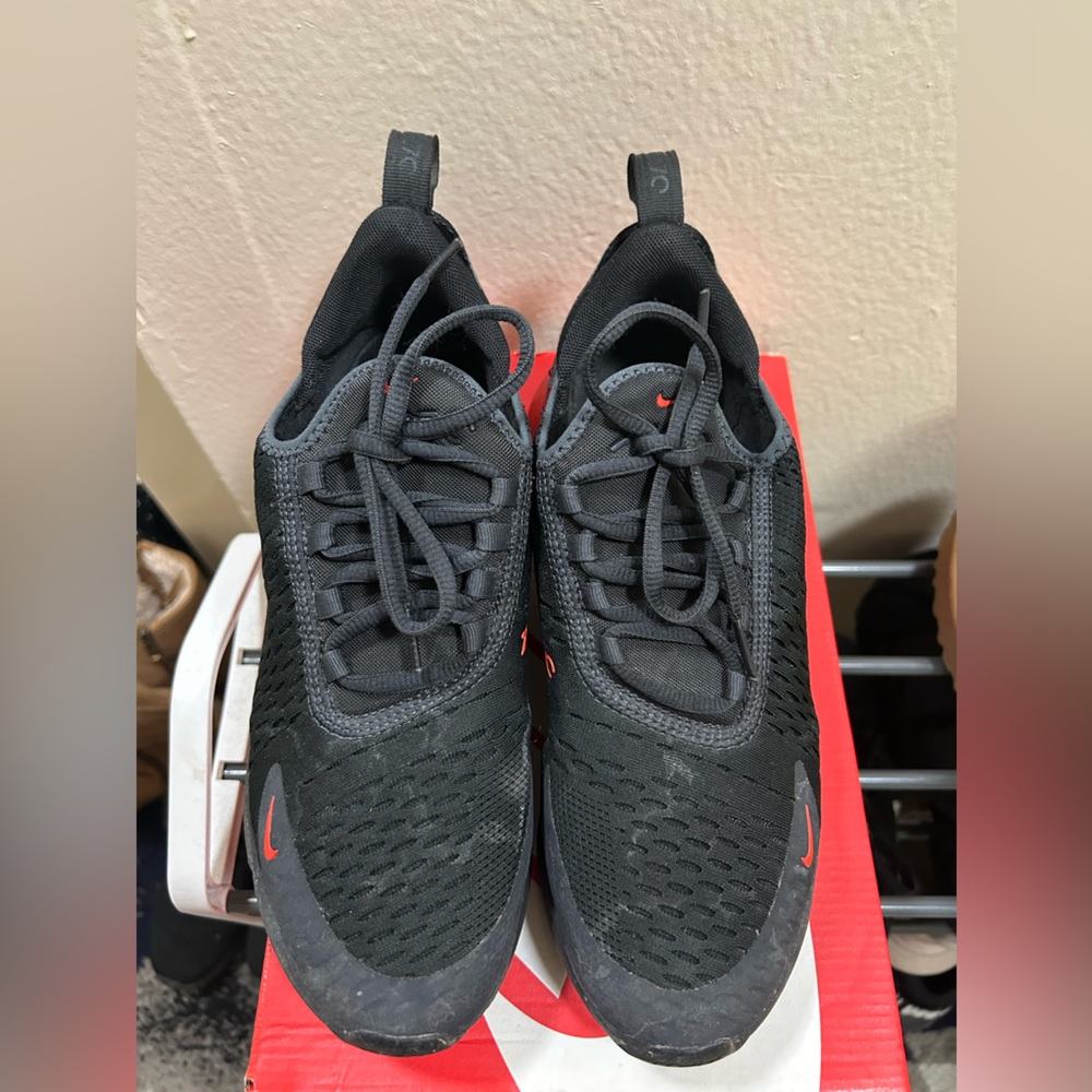 Red and black Nike shoes